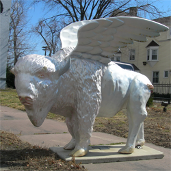 Statue of a buffalo with wings.